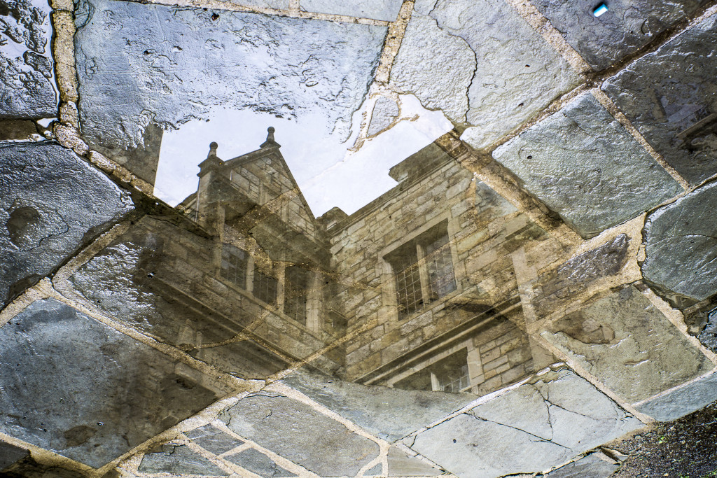 A building reflected in water