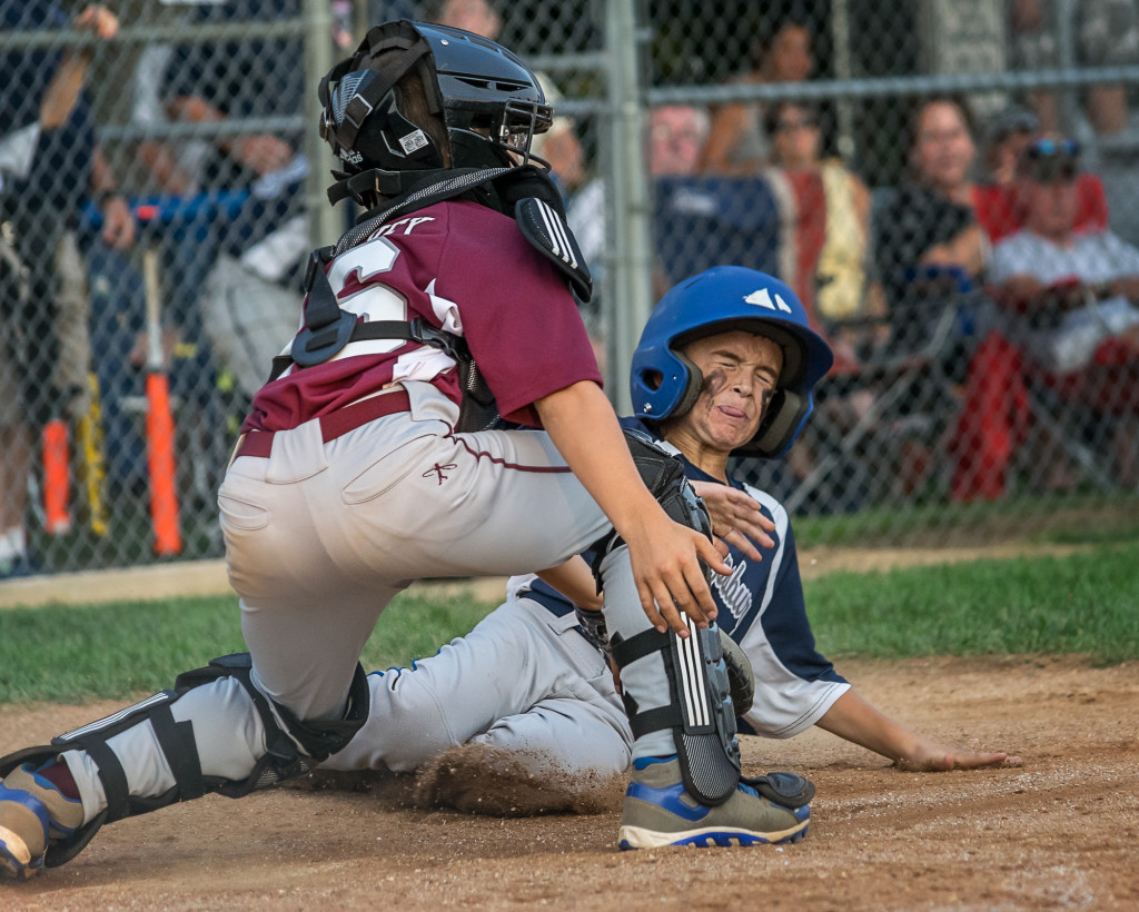 A Play at the Plate during a Little League baseball game